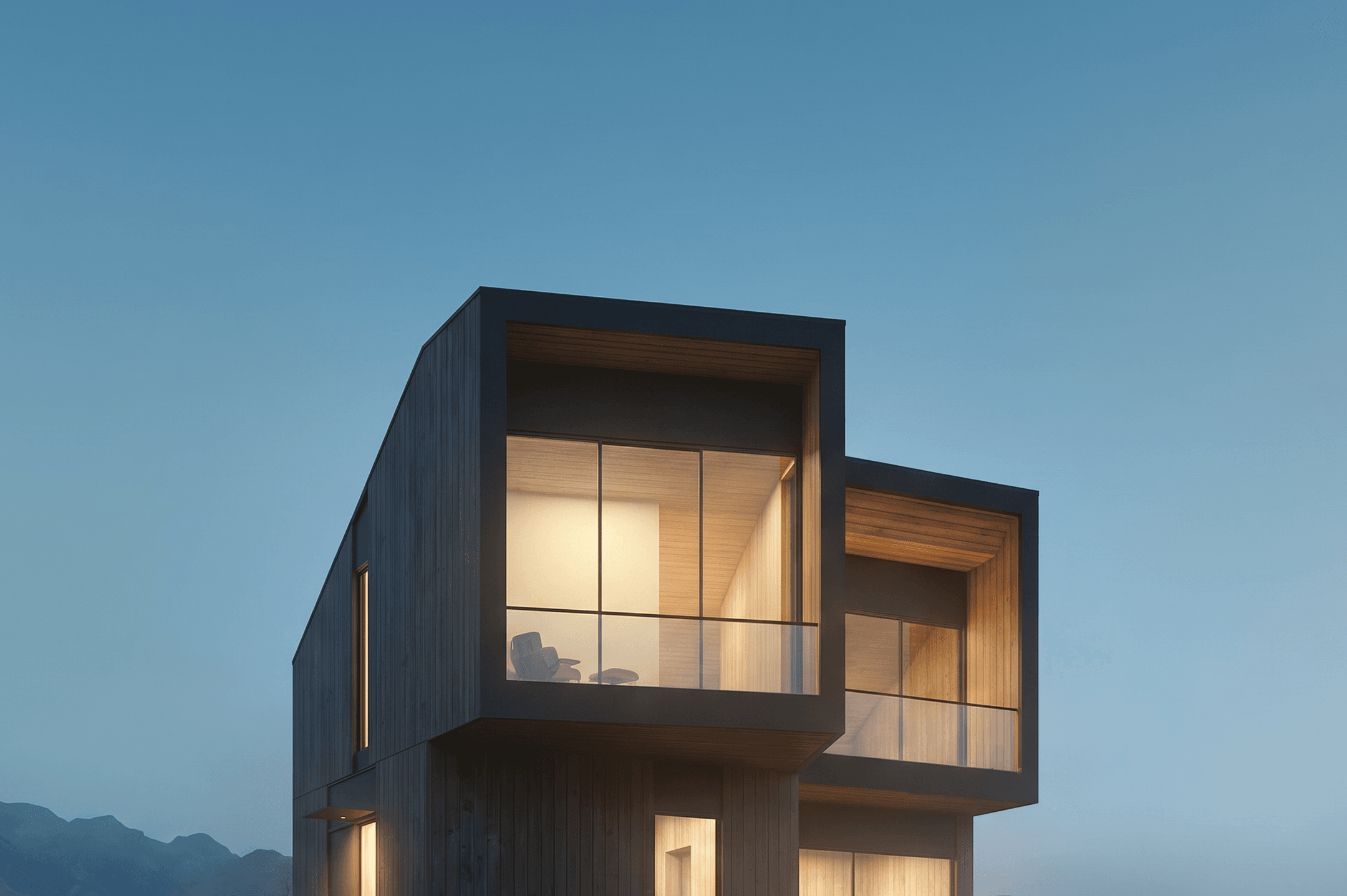 The house on its ridge at blue hour, the last building before open forest.